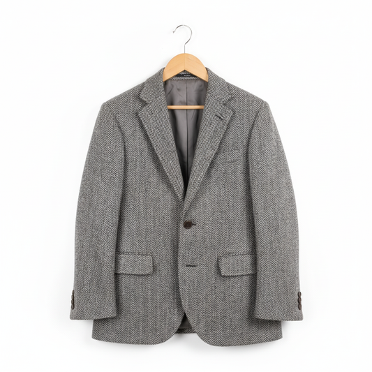 Gray herringbone tweed blazer on coat hanger