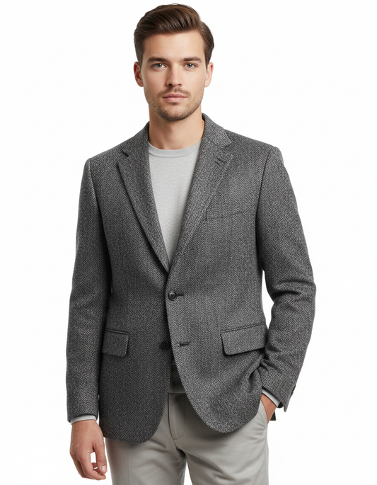 Young male model wearing charcoal gray herringbone tweed blazer